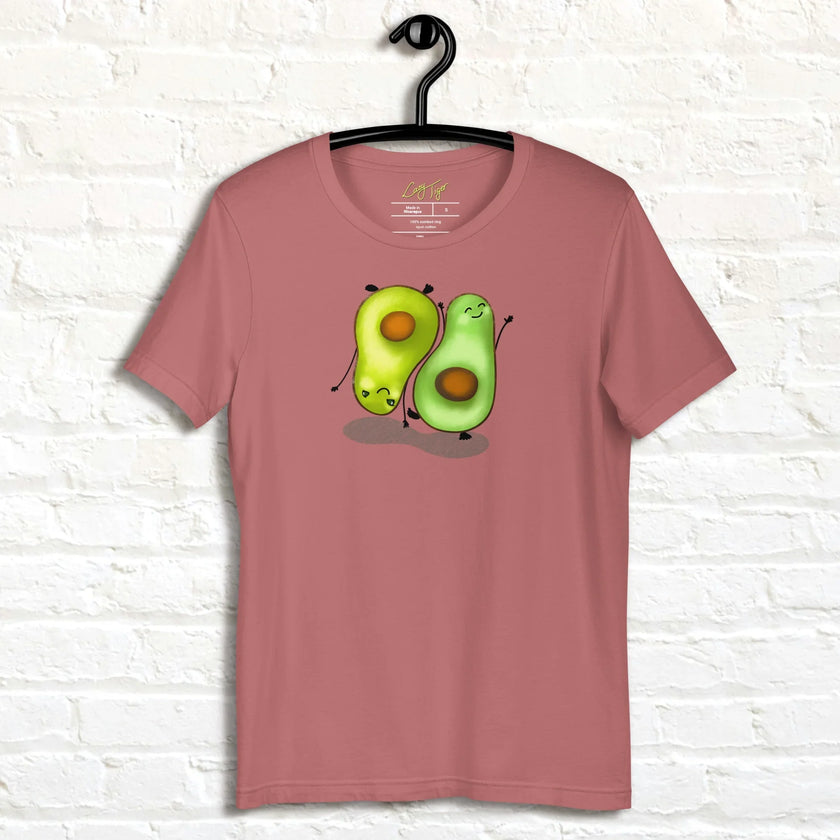 Rosewood Avocado Yoga Tee displayed on a hanger, featuring two adorable avocados practicing yoga with friendly faces and a warm, cozy color palette.