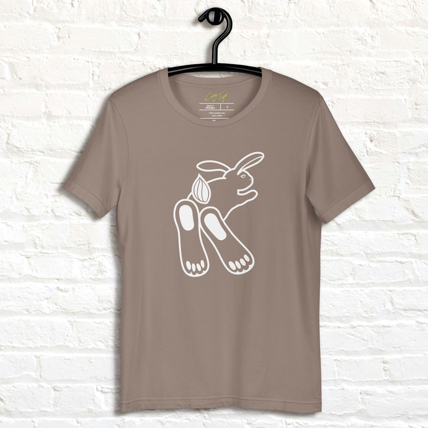 Beige Chill Bunny Line Art Tee hanging on a wall, showing the clean white rabbit line drawing.