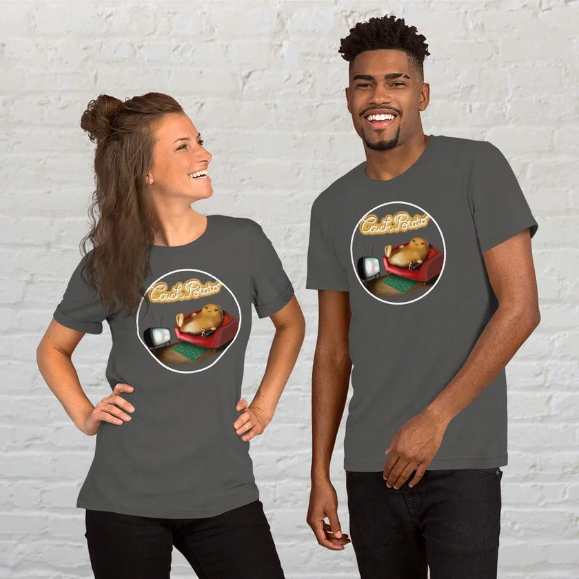 Two people wearing matching graphite grey Lazy Potato Tees, featuring the cute potato lounging on a couch with glowing ‘Couch Potato’ text.