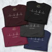 Folded Lost in Music Line Art Tees in all five available colors, each displaying the heartbeat‑to‑treble‑clef graphic and ‘Lost in music…’ text.