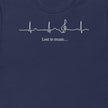 Thumbnail close-up of the Lost in Music design on a navy tee, showing the ECG‑style heartbeat transitioning into a treble clef with the ‘Lost in music…’ script.