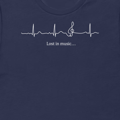 Thumbnail close-up of the Lost in Music design on a navy tee, showing the ECG‑style heartbeat transitioning into a treble clef with the ‘Lost in music…’ script.