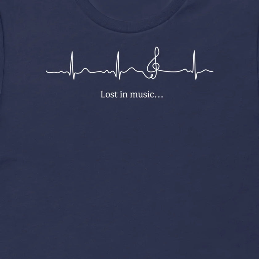 Thumbnail close-up of the Lost in Music design on a navy tee, showing the ECG‑style heartbeat transitioning into a treble clef with the ‘Lost in music…’ script.