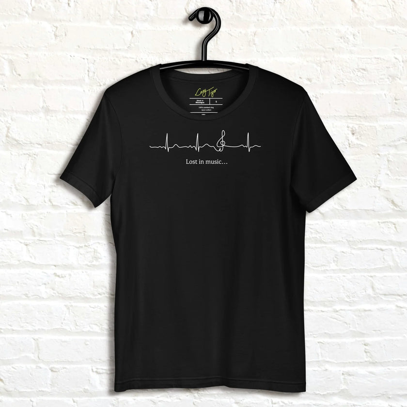 Black Heartbeat Music Tee on a hanger featuring the clean ECG‑style heartbeat line merging into a treble clef with the text ‘Lost in music…,’ printed in high‑contrast white on smooth black cotton