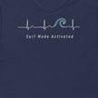 Thumbnail close-up of the Surf Mode Activated design on a navy tee, showing the heartbeat line flowing into a surf wave with the ‘Surf Mode Activated’ script.
