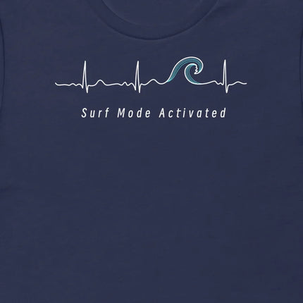 Thumbnail close-up of the Surf Mode Activated design on a navy tee, showing the heartbeat line flowing into a surf wave with the ‘Surf Mode Activated’ script.