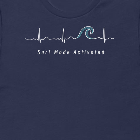 Thumbnail close-up of the Surf Mode Activated design on a navy tee, showing the heartbeat line flowing into a surf wave with the ‘Surf Mode Activated’ script.