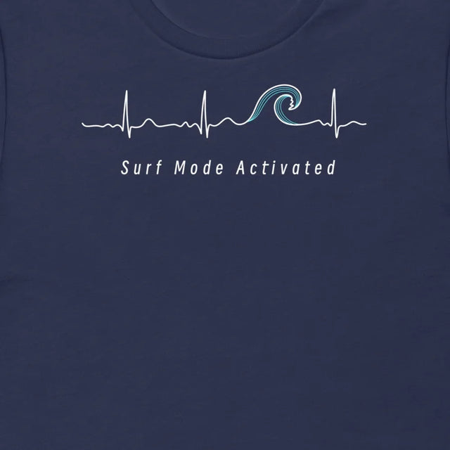 Thumbnail close-up of the Surf Mode Activated design on a navy tee, showing the heartbeat line flowing into a surf wave with the ‘Surf Mode Activated’ script.