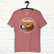 Rosewood Lazy Potato Tee hanging against a neutral background, featuring the funny potato lounging on a couch with neon ‘Couch Potato’ text.