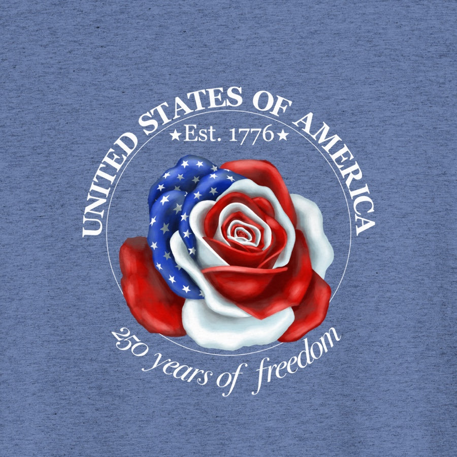 Thumbnail close-up of the Liberty Rose design on a vintage blue tee, showing the red‑white‑and‑blue rose and surrounding commemorative text.