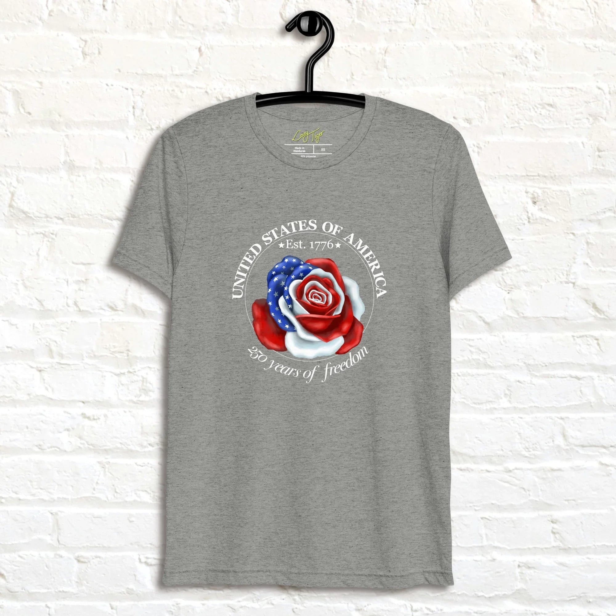 Heather grey tee featuring a rose illustration made from American flag colors, with red, white, and blue petals and white star accents, shown on a hanger.