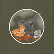 Closeup of olive green Pizza Raptor tee showing detailed dinosaur eating pizza, high‑quality print on unisex shirt.