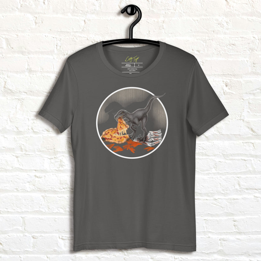 Dark graphite T‑shirt on hanger with cartoon velociraptor eating pizza, humorous dino graphic tee for men and women.