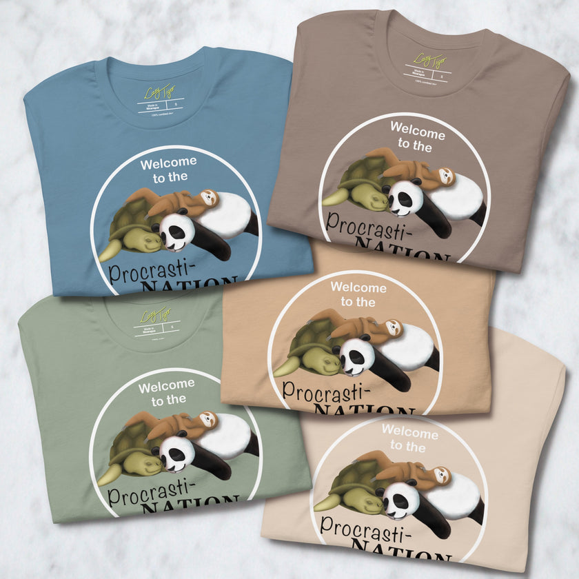 Five folded Procrasti‑NATION tees in sage, denim blue, taupe, beige, and cream showing the sleepy sloth, panda, and turtle design for cute animal shirt collections.