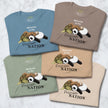 Five folded Procrasti‑NATION graphic tees in sage, denim blue, taupe, beige, and cream showing the sleepy sloth, panda, and turtle design for cute animal shirt collections.