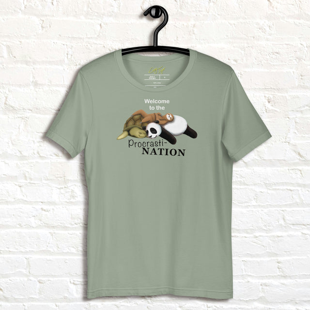 Sage green Procrasti‑NATION shirt on hanger featuring sleepy sloth, panda, and turtle graphic for procrastination and cozy aesthetic lovers.