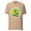 Beige tee on a bodyform featuring two cute avocados in opposite poses, one standing and one upside down in a handstand