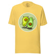 Yellow tee shown on a bodyform with two playful avocados in mirrored poses, one standing and one handstanding