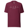 Burgundy Heartbeat Music Tee displayed on a bodyform showing the minimalist ECG‑inspired heartbeat line transitioning into a treble clef with ‘Lost in music…,’ printed in bright white on breathable cotton