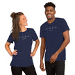 Two models wearing the navy Heartbeat Music Tee with the heartbeat‑wave treble‑clef design and ‘Lost in music…’ text, styled in a clean, modern music‑lover outfit