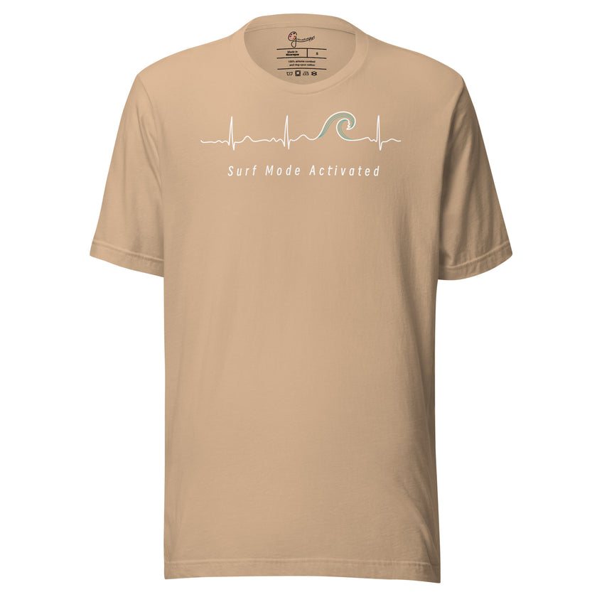 Beige Heartbeat Surf Tee displayed on a bodyform featuring the ECG‑style heartbeat line flowing into a surf wave with ‘Surf Mode Activated,’ printed in soft contrasting tones on light cotton fabric