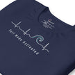 Detail shot of the navy Heartbeat Surf Tee showing the printed neck label and the ECG‑style heartbeat line transitioning into a surf wave, highlighting the smooth cotton texture and clean white print