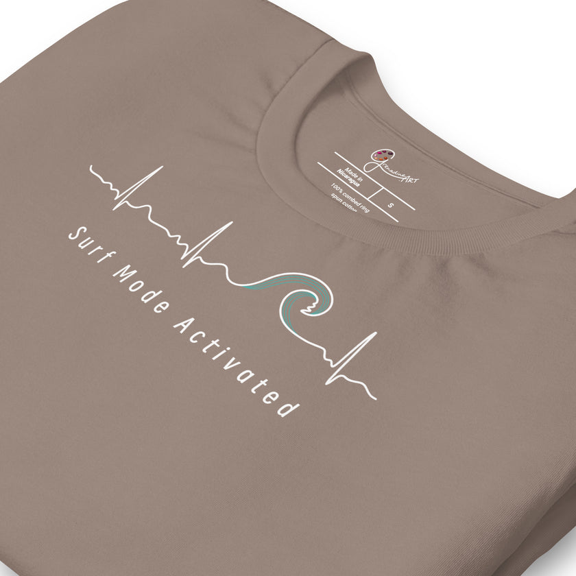 Detail shot of the taupe Heartbeat Surf Tee showing the printed neck label and the ECG‑style heartbeat line flowing into a surf wave, with crisp white print on smooth cotton fabric