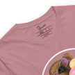 Detail shot of a joyful brown bear wearing white sunglasses with pink lenses, eating ice-cream, printed on a rosewood tee with a visible brand label