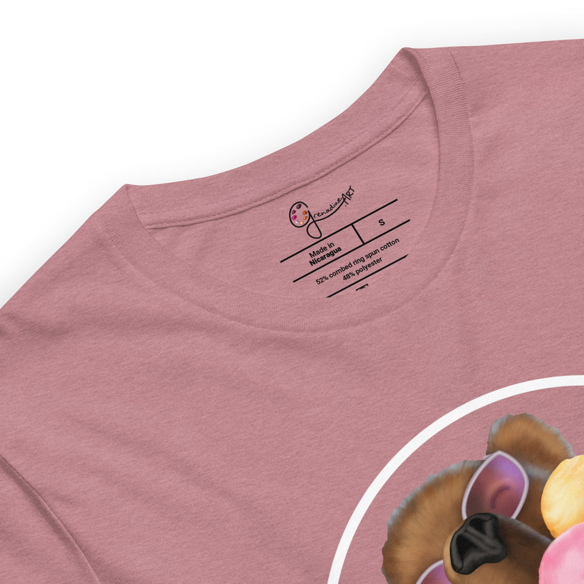 Detail shot of a joyful brown bear wearing white sunglasses with pink lenses, eating ice-cream, printed on a rosewood tee with a visible brand label