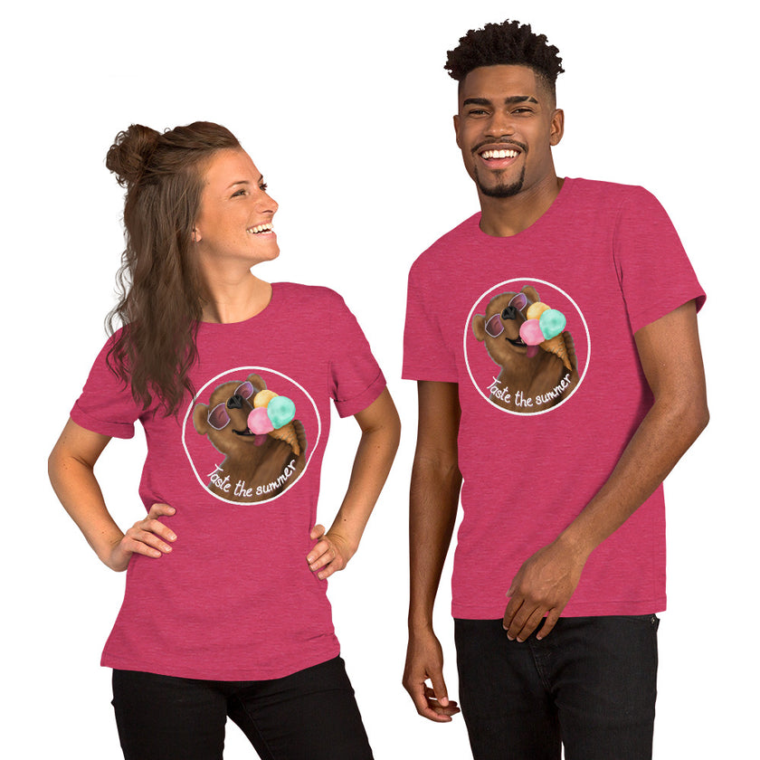 Model mockup of a raspberry tee with a cute brown bear wearing white sunglasses with pink lenses, enjoying a triple‑scoop ice cream and smiling happily