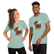 Model mockup of a sage green tee with a kawaii brown bear wearing white sunglasses with pink lenses, enjoying a triple‑scoop ice cream and smiling with its mouth open