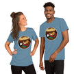Model mockup of a denim blue tee featuring a kawaii lazy potato stretched out on a couch watching TV