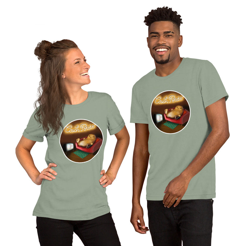 Model mockup of a sage green tee featuring a funny lazy potato relaxing on a couch watching TV