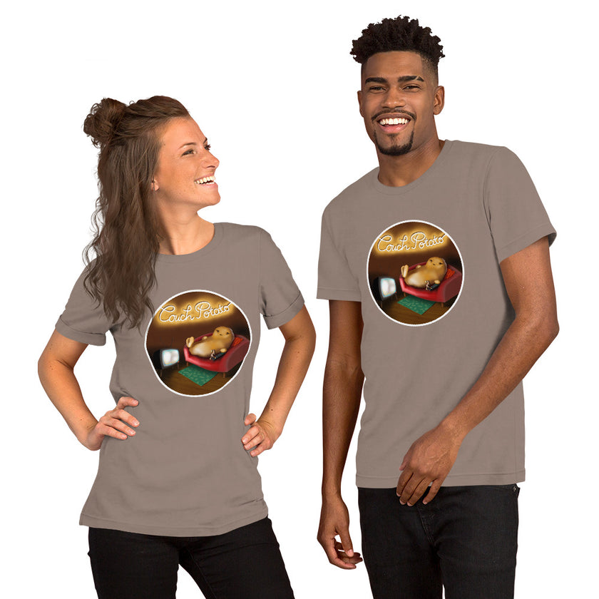 Model mockup of a taupe tee with a cute cartoon potato lounging lazily on a sofa in front of the TV