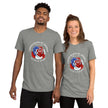 Model mockup of heather grey Liberty Rose tee featuring a rose composed of American flag colors with star‑patterned blue petals