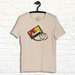 Cream white Retro Vibes Cassette Tee hanging on a wall, showing the colorful cassette illustration with its tape forming a heart.
