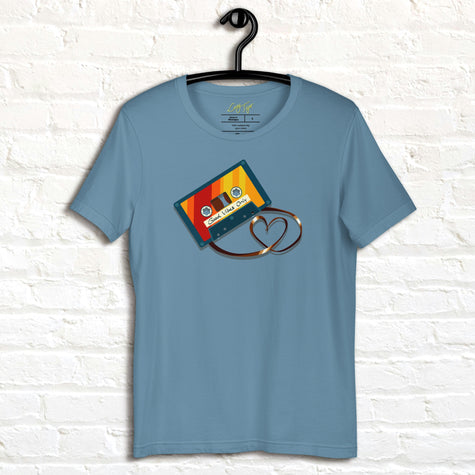 Denim blue Retro Vibes Cassette Tee displayed on a hanger, featuring the bold vintage cassette with its tape forming a heart shape.