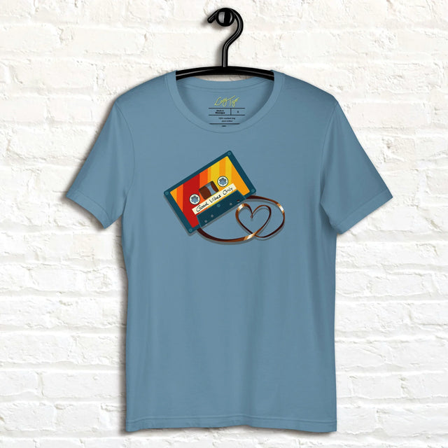 Denim blue Retro Vibes Cassette Tee displayed on a hanger, featuring the bold vintage cassette with its tape forming a heart shape.