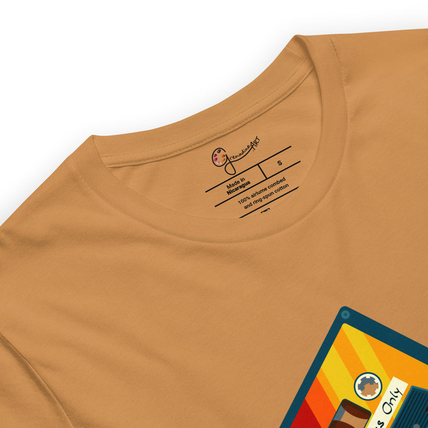 Detail shot of the vintage cassette and a brand label on a mustard yellow tee